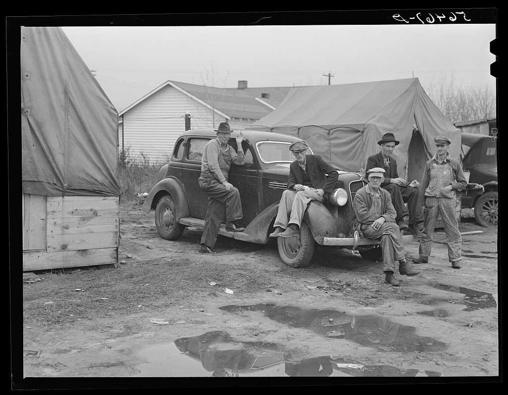 Marion Post Wolcott photograph, FSA 1940 — residents of a migrant labor camp whose names and complaints the federal photographer recorded
