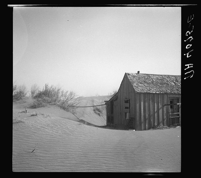 Arthur Rothstein, 1936 — an abandoned Oklahoma farmhouse buried in drifted topsoil, FSA