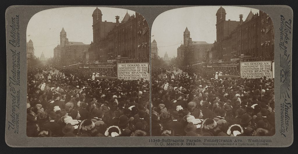 Underwood and Underwood, 1913 — a suffrage stereograph reading 'We demand an amendment'