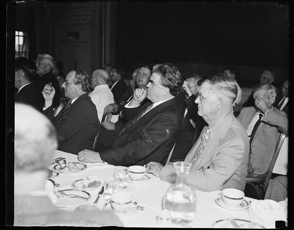 Harris and Ewing, 1936 — John L. Lewis sits listening to Gerald L.K. Smith