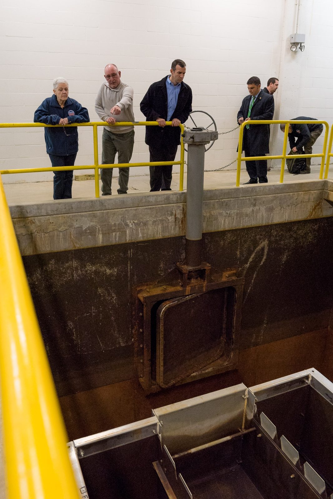 Officials inspect the corroded Flint Water Treatment Plant basin, February 2 2016