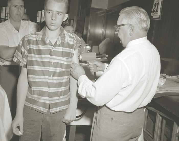 A boy receiving polio vaccine by jet injector at a 1960 Rhode Island mass vaccination campaign